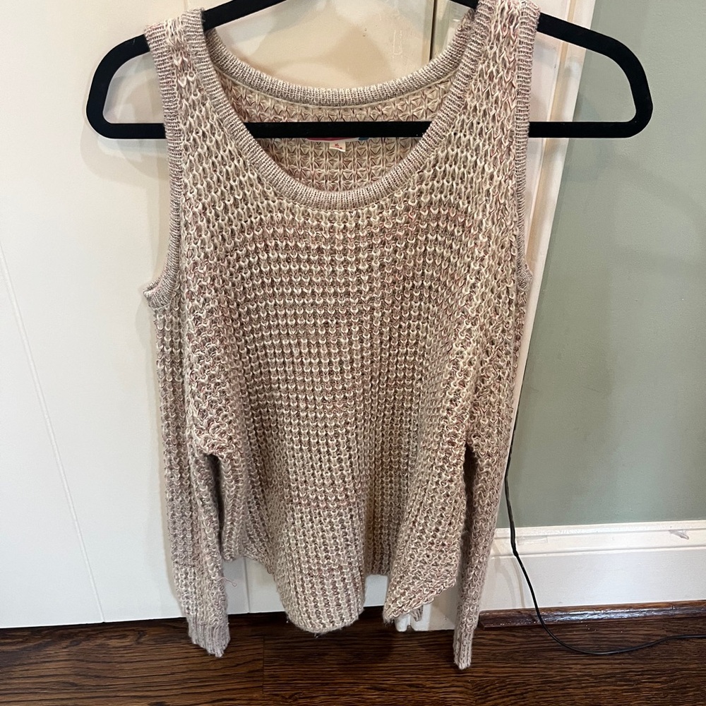 Sweater with open shoulder